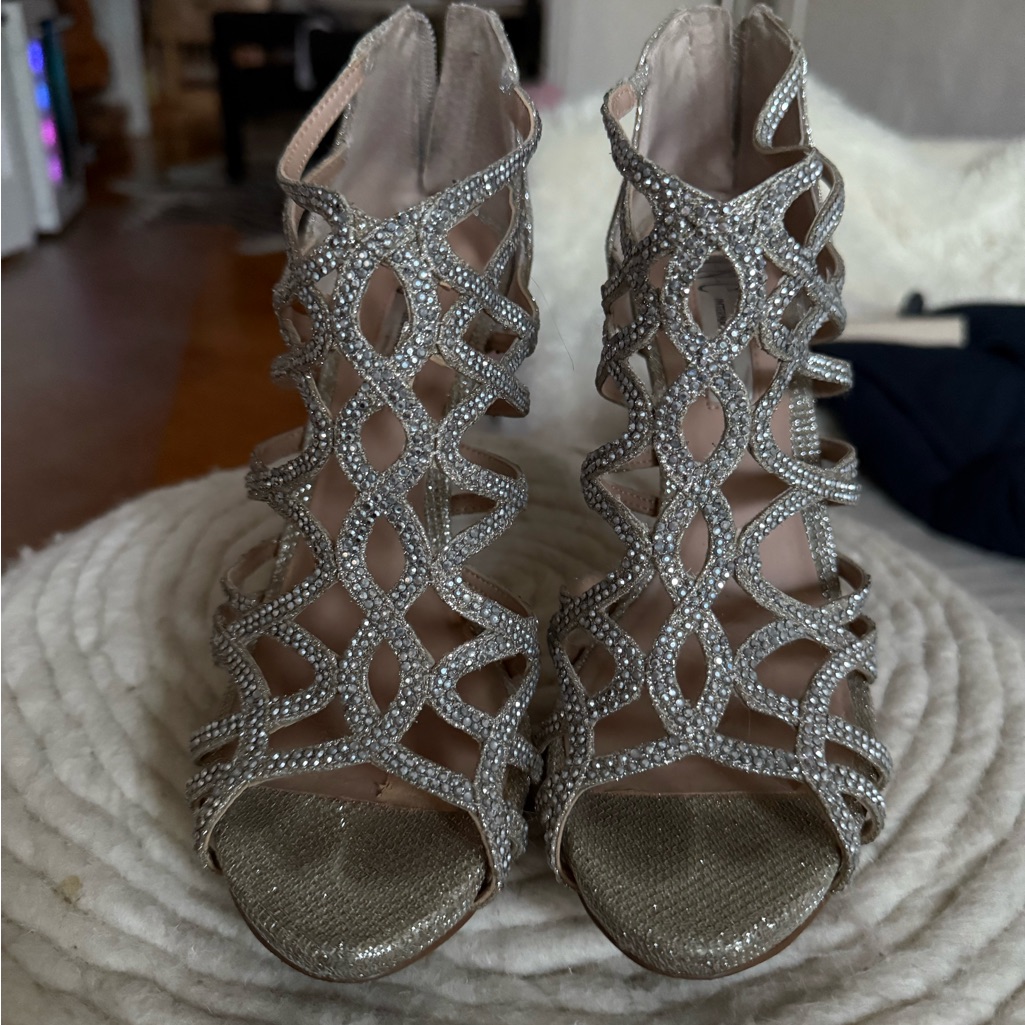 Silver Heels With Open Toe And Intricate Cutout Design